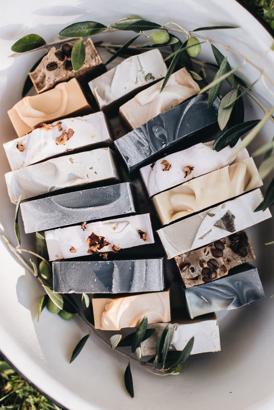 A white bowl full of hand made soap