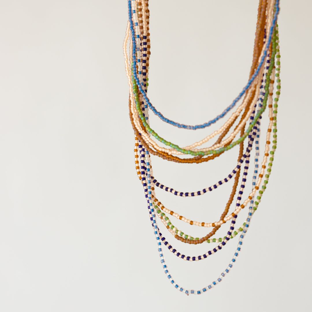 Beads of Hope, by Gather + Harvest is your summertime staple, as they go with anything.  Wrap them around your arm as a bracelet or hang them long as a necklace,