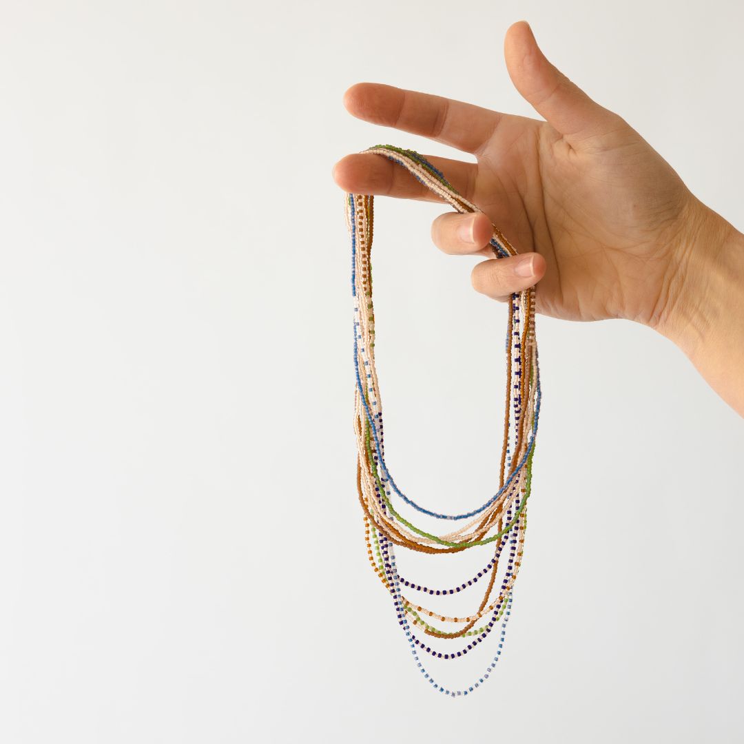 Beads of Hope, by Gather + Harvest is your summertime staple, as they go with anything.  Wrap them around your arm as a bracelet or hang them long as a necklace,