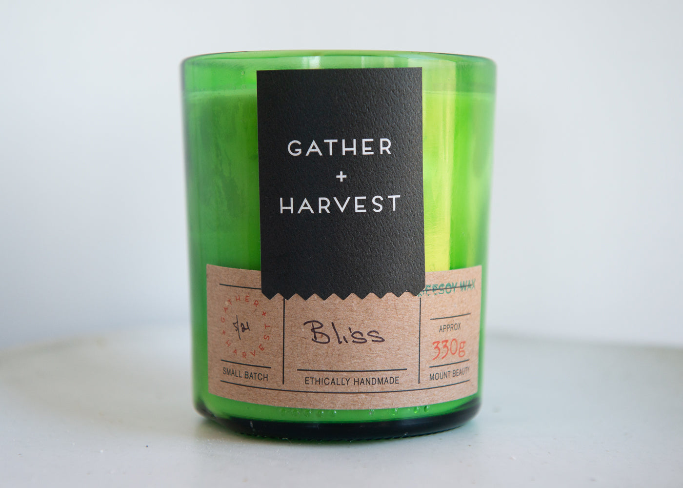 This handmade BeeSoy Candle in Bliss scent is ethically made in the Gather + Harvest Studio