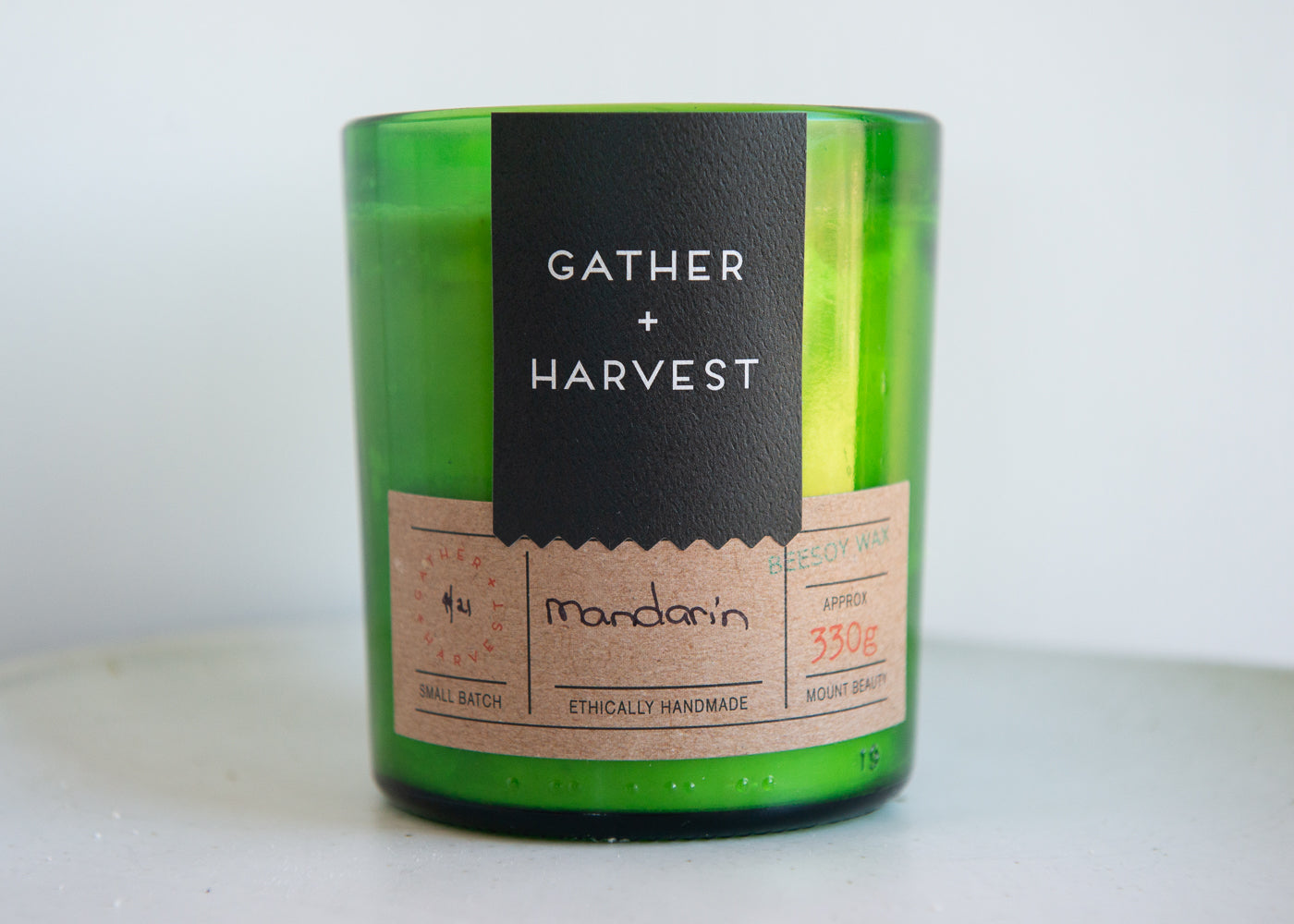This handmade BeeSoy Candle in Mandarin scent is ethically made in the Gather + Harvest Studio